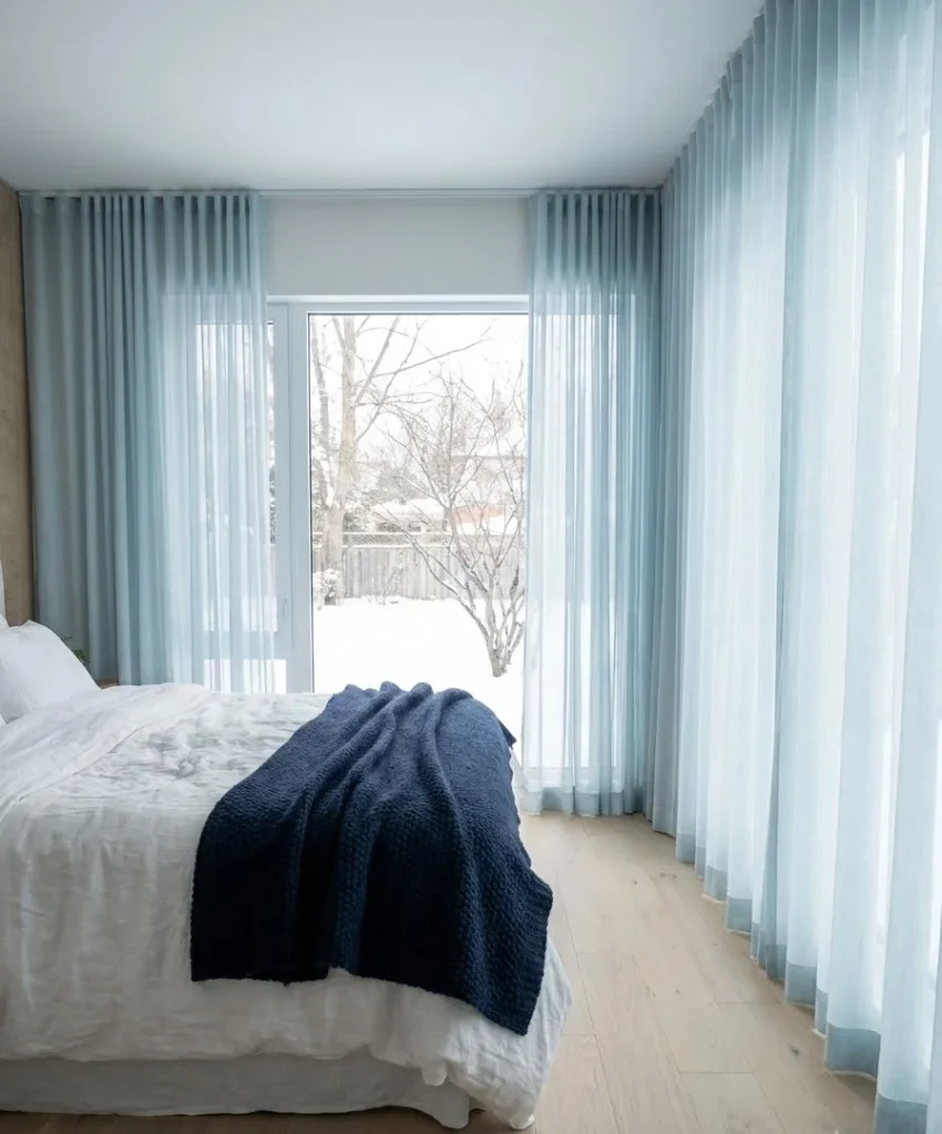 Hang sheer ice-blue curtains