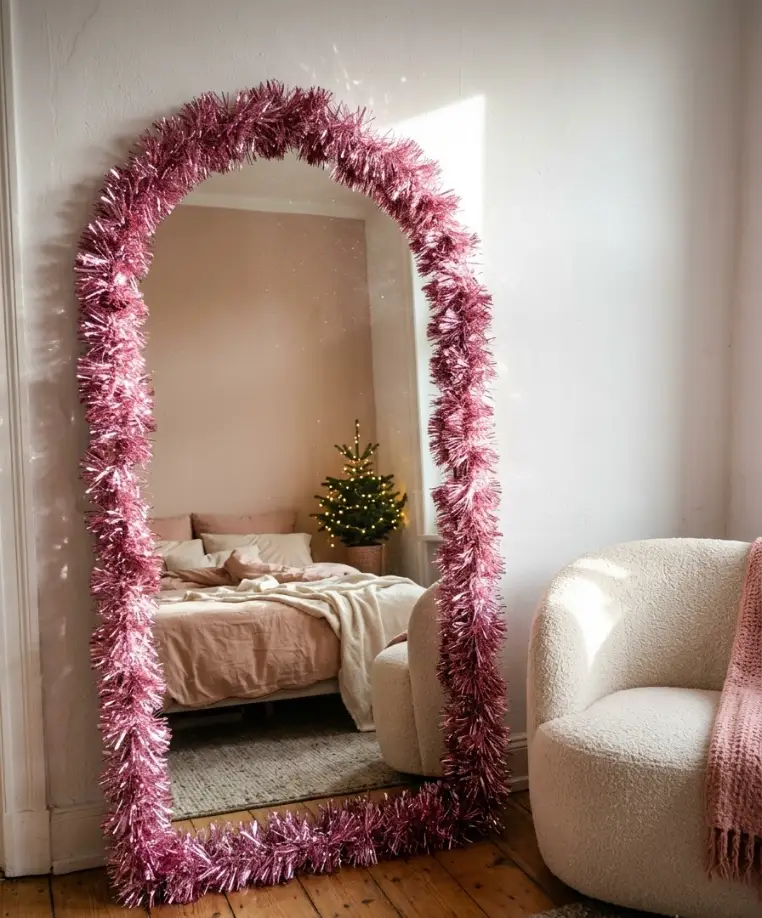 Pink tinsel garland on the mirror