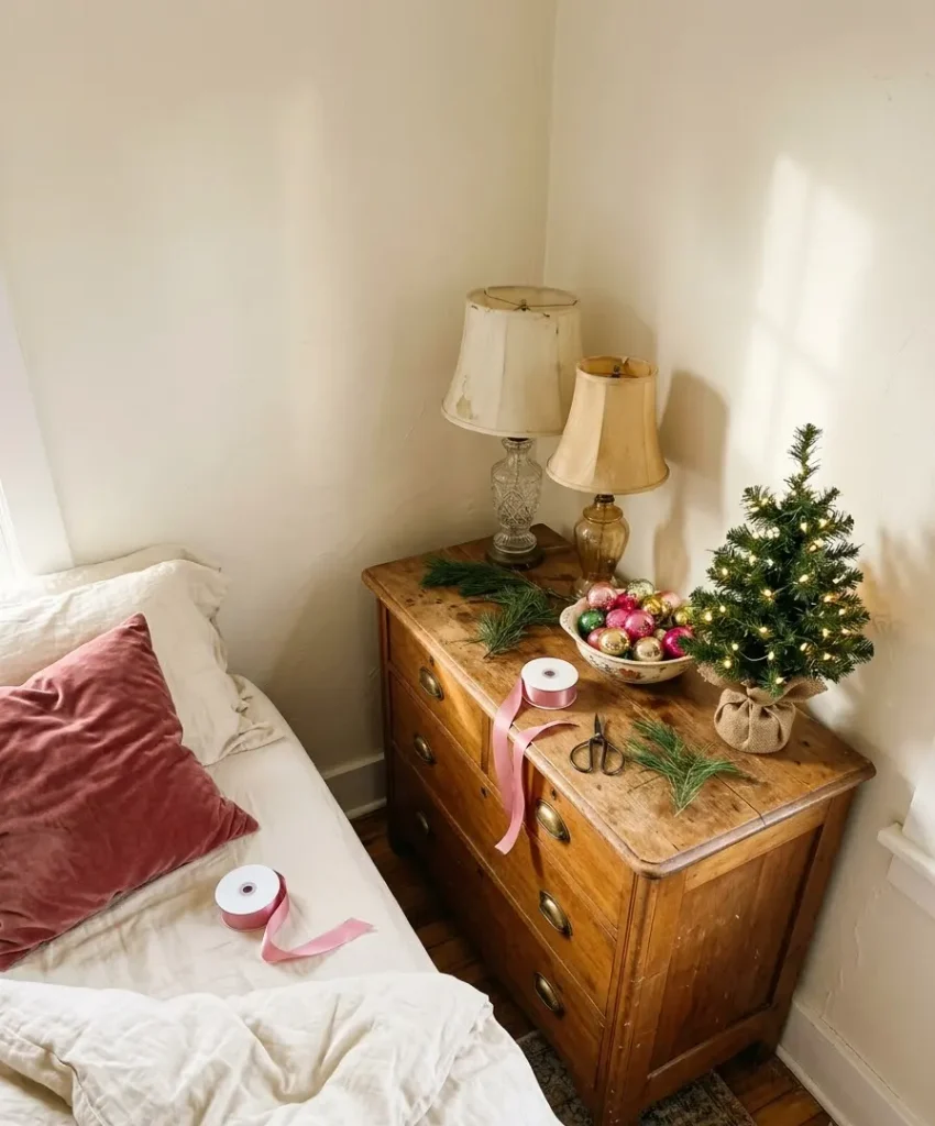 Pink-toned garland above the headboard